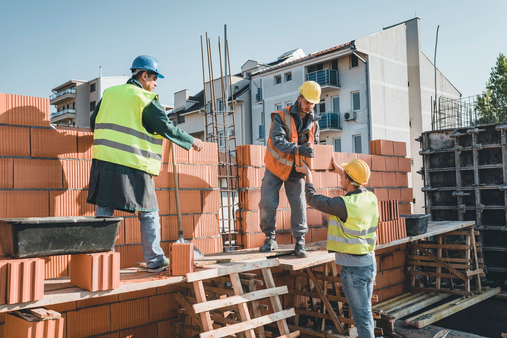 Construction team completing masonry work on site