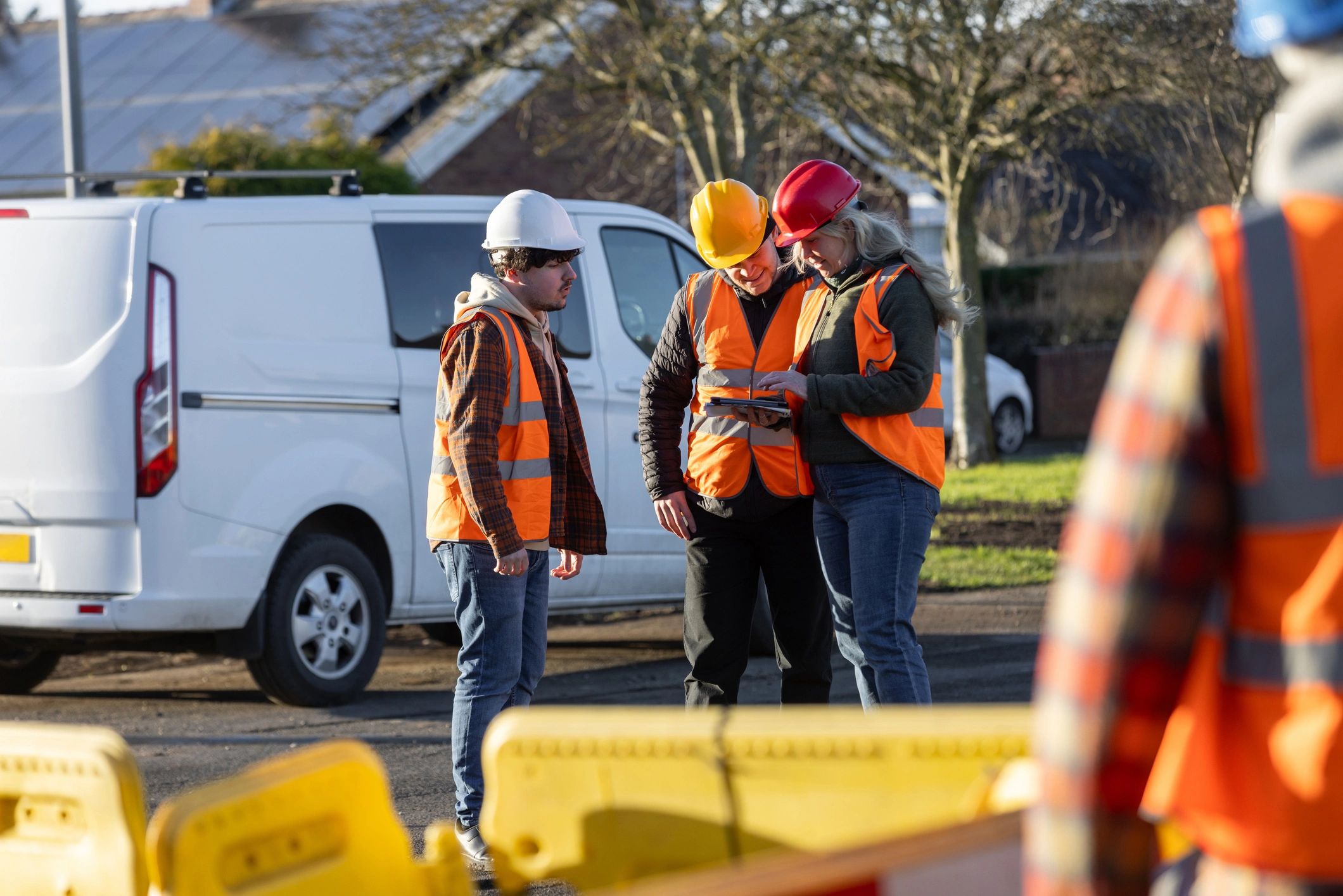 Construction team reviewing a project on site
